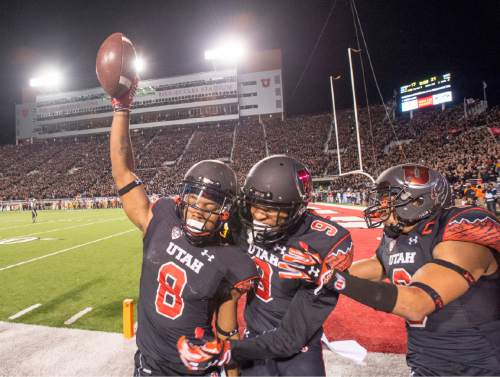 Rick Egan  |  The Salt Lake Tribune
 
Utah Utes wide receiver Kaelin Clay (8) celebrates with wide receiver Tim Patrick (9) after scoring the game-winning touchdown, with 8 seconds left in the game, giving the Utes a 24-21 victory of the USC Trojans in Pac-12 action at Rice-Eccles Stadium, Saturday, October 25, 2014.