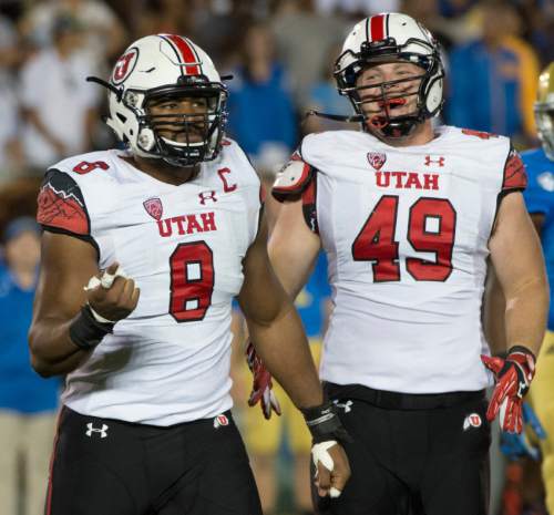 Rick Egan  |  The Salt Lake Tribune

Utah Utes defensive end Nate Orchard (8) celebrates a quarter back sack, along with defensive end Hunter Dimick (49), in Pac 12 action Utah vs. UCLA, at the Rose Bowl in Pasadena, Saturday, October 4, 2014