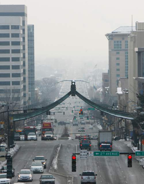Francisco Kjolseth  |  The Salt Lake Tribune
An inversion obscures the horizon down State street in Salt Lake City in January 2013. The Salt Lake County health board wants a ban of wood burning on 'voluntary' no-burn days.