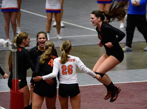Scott Sommerdorf  |  The Salt Lake Tribune
Timpview's Lacy Haddock, right,  jumps as she and the team celebrates a point during the third set as Timpview defeated Sky View 3-0 in their 4A volleyball championship match at UCCU, Saturday, November 8, 2014 in Provo.