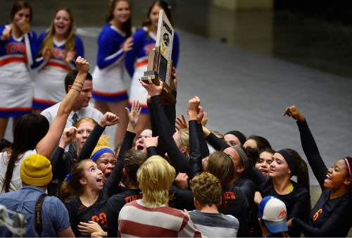 Scott Sommerdorf  |  The Salt Lake Tribune
Timpview players and fans mob the floor after the 4A trophy was presented. Timpview defeated Sky View 3-0 in their 4A volleyball championship match at UCCU, Saturday, November 8, 2014.