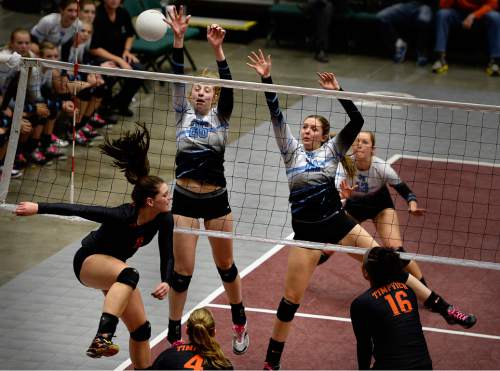Scott Sommerdorf  |  The Salt Lake Tribune
Sky View's Shannon Sorensen, left, and Sydnee Ahlmer try to block this shot by Timpview's Lacy Haddock during the first set. Timpview beat Sky View 25-23 in the first set of their 4A volleyball championship match at UCCU, Saturday, November 8, 2014 in Provo.