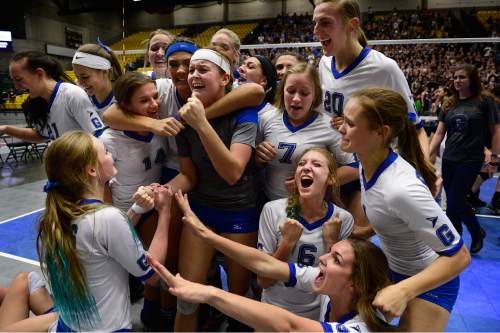 Scott Sommerdorf  |  The Salt Lake Tribune
Pleasant Grove celebrates after they defeated Lehi 3-1 to win the state 5A volleyball championship at UCCU, Saturday, November 8, 2014.