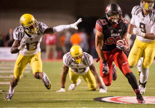 Rick Egan  |  The Salt Lake Tribune

 Ute running back Devontae Booker (23) runs the ball into the end zone for a touchdown, in Pac-12 football action, Utah vs. Oregon game, at Rice-Eccles Stadium, Saturday, November 8, 2014