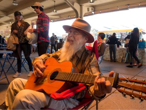 Trent Nelson  |  The Salt Lake Tribune
Anastacio Castillo plays and sings at the Winter Market, held the Rio Grande Depot in Salt Lake City, Saturday November 8, 2014. This year's winter farmers market features more than 60 vendors selling produce, meat, eggs and more. The market will run every other Saturday through April 25.