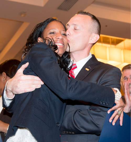 Steve Griffin  |  The Salt Lake Tribune

Mia Love gets a kiss from her husband Jason after defeating opponent Doug Owens in the race for Utah's 4th Congressional District, Tuesday November 4, 2014.