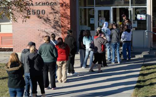 Francisco Kjolseth  |  The Salt Lake Tribune
Long lines form outside of Magna Elementary with parents having to pick up their kids after police put four area schools on lockdown in Magna after reports that a student brought a gun to Brockbank Jr. High on Tuesday, Nov. 11, 2014. The weapon turned out to be a toy.