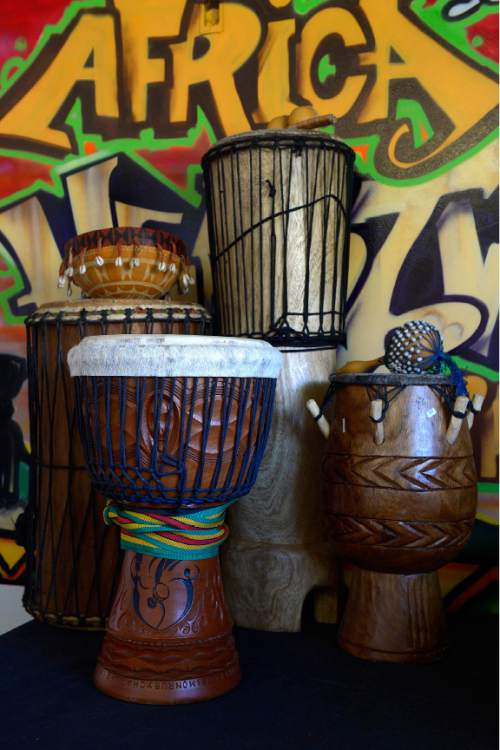 Leah Hogsten  |  The Salt Lake Tribune
l-r West African drums; Dunun, Djembe, Ngoma and Adowa drums.  Andy Jones of the Africa Heartwood Project, a grass-roots, nonprofit seeking to redress causes and symptoms of poverty in West Africa. Jones works with dozens of cultural artisans in the countries of Ghana, Mali, Guinea, Senegal and the Ivory Coast to ensure sustainability of their livelihoods through training, micro-credit, and access to international fair-trade markets.