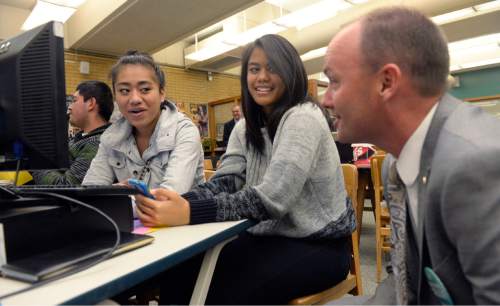 Al Hartmann  |  The Salt Lake Tribune
Utah Lt. Gov. Spencer Cox speaks to Kearns High School seniors Susana Kaufusi, left, and   Victoria Alofipo Wednesday Nov. 12 as they apply online for three different state colleges during Utah College Application Week.