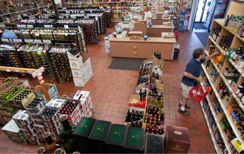 Michael Mangum  |  The Salt Lake Tribune

Doug Sloan, right, organizes inventory at the Utah State Liquor Store on Monday, September 20, 2010. It's business as usual, for now, at the 1457 South Main Street store, but tentative plans are for the store to close on September 30, 2010.