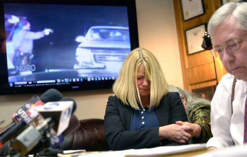 Al Hartmann  |  The Salt Lake Tribune
Kristine Biggs Johnson breaks down as her attorney Bob Sykes, plays a Youtube video from a law enforcement dashcam when she was shot in the eye November 2012.  Her attorney Bob Sykes is filing a federal civil rights lawsuit Thursday November 13 against a Morgan County Sheriff's deputy for improper use of deadly force against her. The shooting was deemed unjustified by Davis County Attorney Troy Rawlings, but no charges were filed against the deputy.