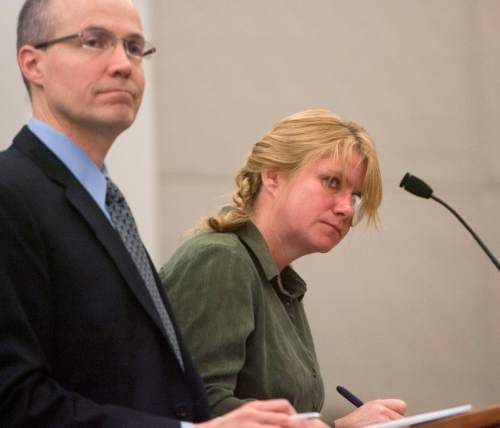 Steve Griffin | The Salt Lake Tribune

Kristine Biggs, who was shot in the eye by a Morgan County police officer after leading them on a chase, stands with her attorney, Michael Edwards, during her sentencing hearing for charges related to the incident at the Davis County Justice Complex  in Farmington, Utah Monday February 25, 2013.
