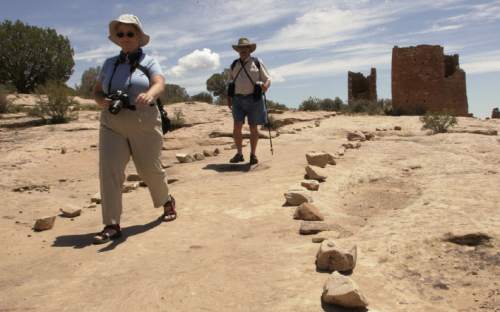 Wendy and Scott Henderson of Livermore California tour the historic ruins of a pueblo people at Hovenweep National Monument in southern Utah. 7/20/06 Jim Urquhart/Salt Lake Tribune