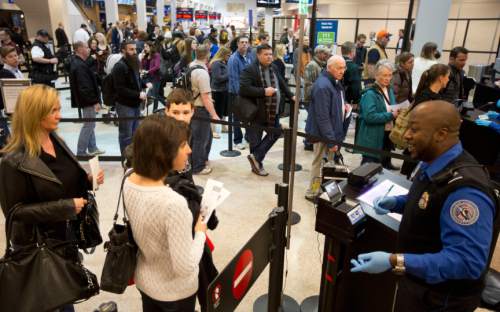 Lennie Mahler  |  The Salt Lake Tribune
Travelers pass through the expedited security line in Salt Lake City International Airport in March. Enrollment in the new TSA Pre-Check program grants passengers an ID number for $85 that allows access to the expedited security line for five years.
