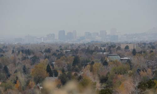 Al Hartmann  |  The Salt Lake Tribune
Downtown Salt Lake City skyline is shrouded in gray clouds and cold temperatures on Thursday morning as the year's first snowstorm starts to drift in from the northwest.
