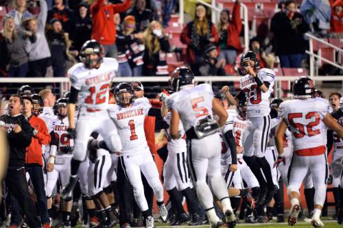 Chris Detrick  |  The Salt Lake Tribune
Members of the Hurricane football team celebrate after recovering a fumble in the final seconds the 3AA state football semifinal game at Rice-Eccles Stadium Friday November 14, 2014. Hurricane defeated Desert Hills 17-14.