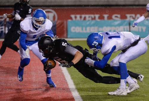 Francisco Kjolseth  |  The Salt Lake Tribune
Jack Bangerter (5) of Pine View dives into the end zone for a touchdown past Dixie in the second quarter in the class 3AA state football semifinal game at Rice Eccles Stadium on Thursday, Nov. 13, 2014.