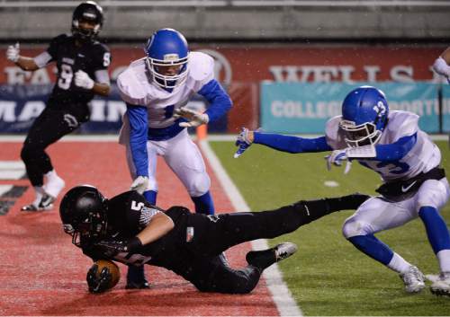 Francisco Kjolseth  |  The Salt Lake Tribune
Jack Bangerter (5) of Pine View dives into the end zone for a touchdown past Dixie in the second quarter in the class 3AA state football semifinal game at Rice Eccles Stadium on Thursday, Nov. 13, 2014.