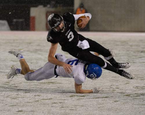 Francisco Kjolseth  |  The Salt Lake Tribune
Pine View quarter back Kody Wilstead (3) is taken down by Jaden Harrison (6) of Dixie in the class 3AA state football semifinal game at Rice Eccles Stadium on Thursday, Nov. 13, 2014.