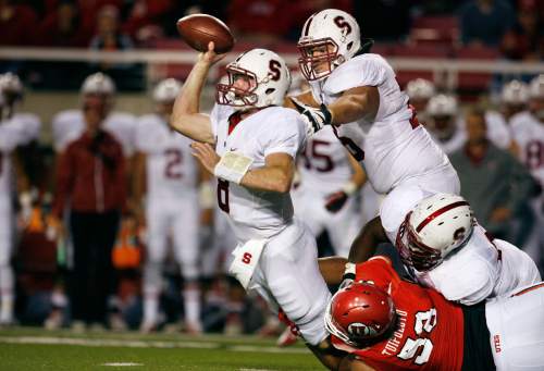 Scott Sommerdorf   |  The Salt Lake Tribune
Stanford Cardinal quarterback Kevin Hogan (8) gets off a pass just as he is about to be sacked by Utah Utes defensive tackle LT Tuipulotu (58) during fourth quarter play. Utah upset #5 Stanford 27-21, Saturday, October 12, 2013.