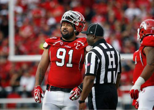 Scott Sommerdorf   |  The Salt Lake Tribune
Utah Utes defensive tackle Tenny Palepoi (91) talks with Pac-12 head linesman Edwin Walker as a Stanford fumble was reviewed during first half play. Utah led Stanford 21-14 at the half, Saturday, October 12, 2013.