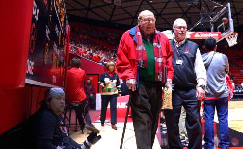 Leah Hogsten  |  The Salt Lake Tribune
Jon M. Huntsman Sr. is led to his seat at The University of Utah's Jon M. Huntsman Center in Salt Lake City, November 14, 2014 for the Utes season home opener.