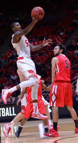 Leah Hogsten  |  The Salt Lake Tribune
Utah Utes guard Delon Wright (55) to the net. The University of Utah defeated Ball State University 90-72 during their home opener at the Jon M. Huntsman Center in Salt Lake City, November 14, 2014.