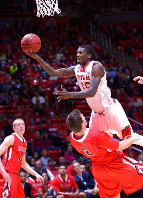Leah Hogsten  |  The Salt Lake Tribune
Utah Utes guard Delon Wright (55) is fouled by Ball State Cardinals forward Matt Kamieniecki (2). The University of Utah leads Ball State University at the half during their home opener at the Jon M. Huntsman Center in Salt Lake City, November 14, 2014.