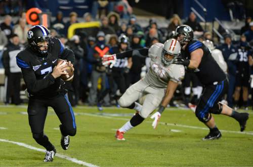 Steve Griffin  |  The Salt Lake Tribune

Brigham Young Cougars quarterback Christian Stewart (7) rolls out to he pocket as looks to pass during first half action in the BYU versus UNLV football game at LaVell Edwards Stadium in Provo, Saturday, November 15, 2014.