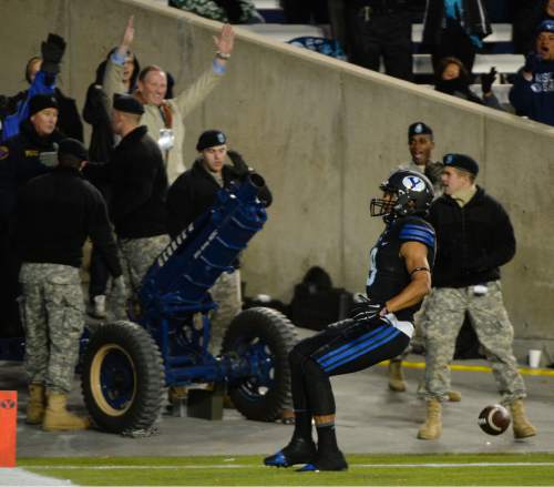 Steve Griffin  |  The Salt Lake Tribune

Brigham Young Cougars wide receiver Jordan Leslie (9) celebrates a touchdown during first half action in the BYU versus UNLV football game at LaVell Edwards Studium in Provo, Saturday, November 15, 2014.