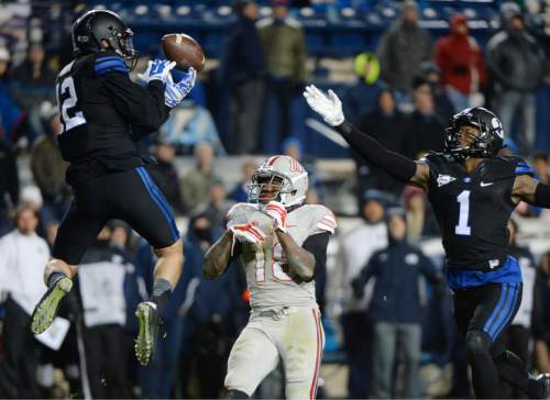 Steve Griffin  |  The Salt Lake Tribune

Brigham Young Cougars defensive back Kai Nacua (12) leaps into the air but can't come up with the interception over UNLV Rebels wide receiver Marcus Sullivan (18) during second half action in the BYU versus UNLV football game at LaVell Edwards Stadium in Provo, Saturday, November 15, 2014.