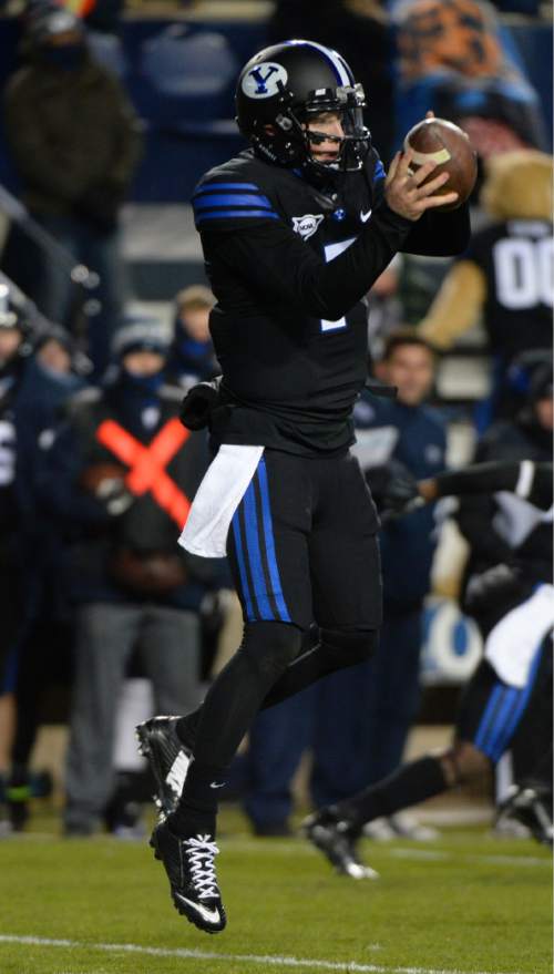 Steve Griffin  |  The Salt Lake Tribune

Brigham Young Cougars quarterback Christian Stewart (7) leaps up for a high snap during second half action in the BYU versus UNLV football game at LaVell Edwards Stadium in Provo, Saturday, November 15, 2014.