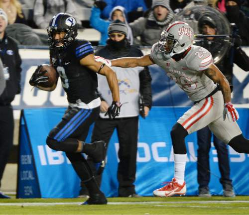 Steve Griffin  |  The Salt Lake Tribune

Brigham Young Cougars wide receiver Jordan Leslie (9) races to the end zone after breaking free during first half action in the BYU versus UNLV football game at LaVell Edwards Studium in Provo, Saturday, November 15, 2014.
