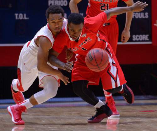 Leah Hogsten  |  The Salt Lake Tribune
Utah Utes guard Brandon Taylor (11) and Ball State Cardinals guard Zavier Turner (1) fight for a loose ball. The University of Utah defeated Ball State University 90-72 during their home opener at the Jon M. Huntsman Center in Salt Lake City, November 14, 2014.