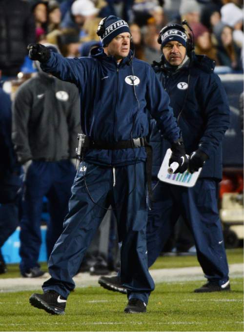 Steve Griffin  |  The Salt Lake Tribune

Brigham Young Cougars head coach rondo Mendenhall signals that a penalty is on UNLV during first half action in the BYU versus UNLV football game at LaVell Edwards Stadium in Provo, Saturday, November 15, 2014.