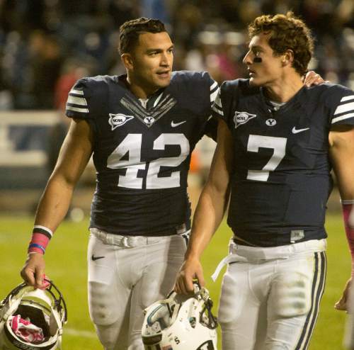 Rick Egan  |  The Salt Lake Tribune


Brigham Young Cougars linebacker Michael Alisa (42) comforts quarterback Christian Stewart (7) after he fumbled the ball with 39 seconds left, as they leave the field after losing to Nevada a 42-35 in football action, BYU vs The Nevada Wolf Pack at Lavell Edwards Stadium, Saturday, October18, 2014.