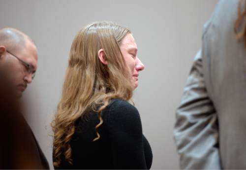 Al Hartmann  |  The Salt Lake Tribune
Stephanie Sloop, charged with aggravated murder in the death of her son, Ethan Stacy, stands with her defense lawyer Mary Corporon and gives an emotional statement accepting her role in her son's death in Judge Thomas Kay's courtroom in Farmington Monday November 17, 2014.  It was scheduled as a preliminary hearing but she ended up pleading guilty to aggravated murder and obstruction of justice which the judge and prosecution accepted.  She was sentenced to 20 years to life.