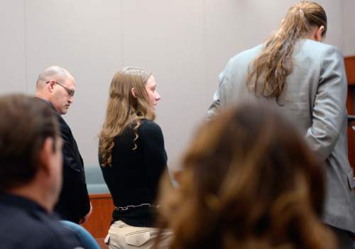 Al Hartmann  |  The Salt Lake Tribune
Stephanie Sloop, charged with aggravated murder in the death of her son, Ethan Stacy, stands with her defense lawyer Mary Corporon and gives an emotional statement accepting her role in her son's death in Judge Thomas Kay's courtroom in Farmington Monday November 17, 2014.  It was scheduled as a preliminary hearing but she ended up pleading guilty to aggravated murder and obstruction of justice which the judge and prosecution accepted.  She was sentenced to 20 years to life.