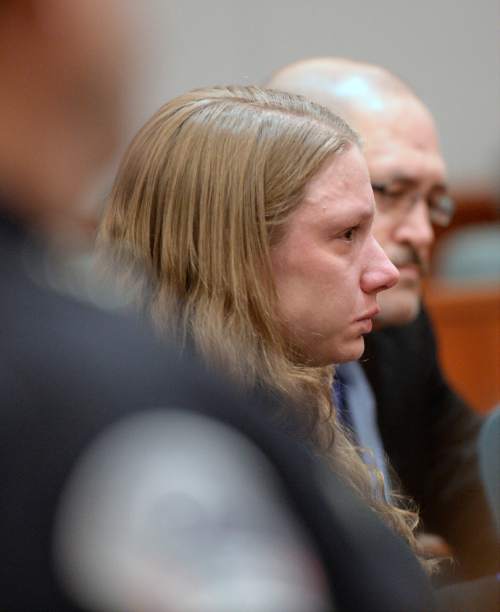 Al Hartmann  |  The Salt Lake Tribune
Stephanie Sloop, charged with aggravated murder in the death of her son, Ethan Stacy, listens to prosecutors' statement in Judge Thomas Kay's courtroom in Farmington Monday November 17, 2014.  It was scheduled as a preliminary hearing but she ended up pleading guilty to aggravated murder and obstruction of justice which the judge and prosecution accepted.  She was sentenced to 20 years to life.