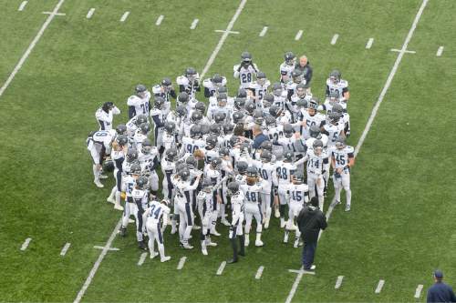 Trent Nelson  |  The Salt Lake Tribune
Corner Canyon players huddle up before facing Roy High School in a  4A state football semifinal game at Rice-Eccles Stadium in Salt Lake City, Friday November 14, 2014.