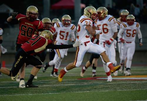 Scott Sommerdorf  |  The Salt Lake Tribune
Judge RB Michael Kearns breaks free during a first half run. Judge defeated Juab 63-14 for the state 3A championship in Cedar City, Friday, November 14, 2014.