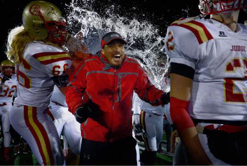 Scott Sommerdorf  |  The Salt Lake Tribune
Judge head coach James Cordova is drenched after Judge defeated Juab 63-14 for the state 3A championship in Cedar City, Friday, November 14, 2014.