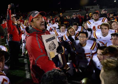 Scott Sommerdorf  |  The Salt Lake Tribune
Judge head coach James Cordova talks to his team after Judge defeated Juab 63-14 for the state 3A championship in Cedar City, Friday, November 14, 2014.