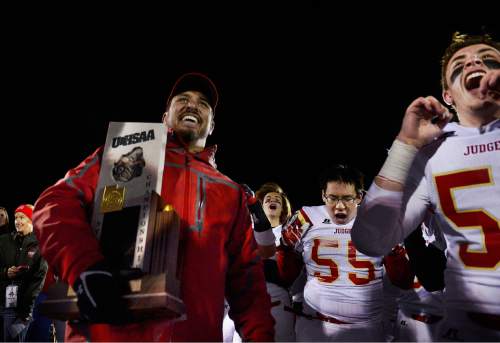 Scott Sommerdorf  |  The Salt Lake Tribune
Judge head coach James Cordova celebrates with his team after Judge defeated Juab 63-14 for the state 3A championship in Cedar City, Friday, November 14, 2014.