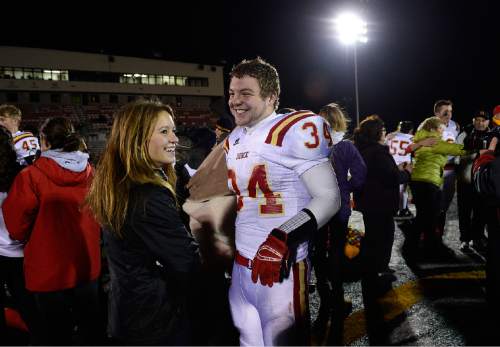 Scott Sommerdorf  |  The Salt Lake Tribune
Star RB Maxwell Barnett and his girlfriend Gabrielle Paul get self-conscious as people see them together after Judge defeated Juab 63-14 for the state 3A championship in Cedar City, Friday, November 14, 2014.