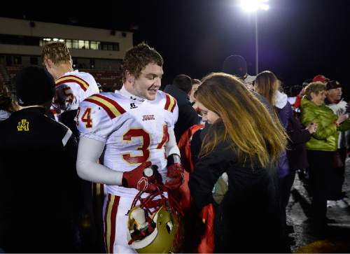 Scott Sommerdorf  |  The Salt Lake Tribune
Star RB Maxwell Barnett has a quiet moment with his girlfriend Gabrielle Paul after Judge defeated Juab 63-14 for the state 3A championship in Cedar City, Friday, November 14, 2014.