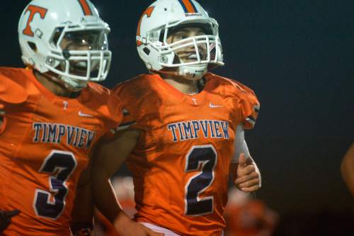 Chris Detrick  |  The Salt Lake Tribune
Timpview's Britain Covey (2) celebrates after his touchdown with Timpview's Jordan Espinoza (3) during the game at Timpview High School Thursday October 2, 2014. Timpview is winning the game 41-0 at halftime.