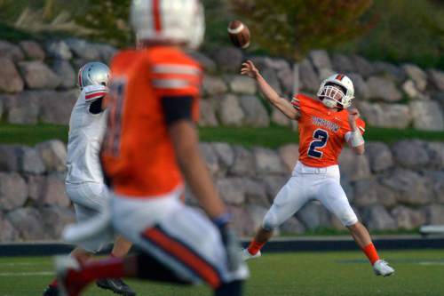 Chris Detrick  |  The Salt Lake Tribune
Timpview's Britain Covey (2) passes the ball to during the game at Timpview High School Thursday October 2, 2014. Timpview is winning the game 41-0 at halftime.