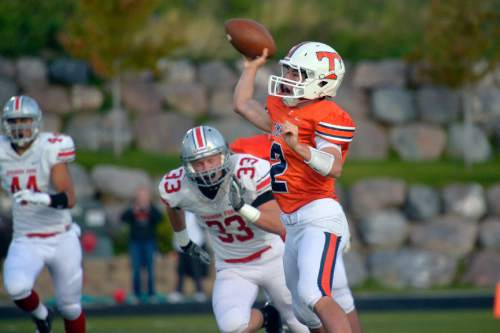 Chris Detrick  |  The Salt Lake Tribune
Timpview's Britain Covey (2) passes the ball during the game at Timpview High School Thursday October 2, 2014. Timpview is winning the game 41-0 at halftime.