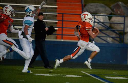 Scott Sommerdorf  |  The Salt Lake Tribune
Timpview QB Britain Covey ran 55 yards for this TD to give Timpview a 21-0 lead during first half play. Timpview beat Sky View of Smithfield, 45-8 in a 4A state quarterfinal playoff game Friday, November 7, 2014 in Provo.